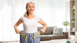 happy-senior-woman-weight-loss-loose-jeans.webp.webp