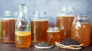 oolong-tea-leaves-with-jars-of-kombucha-and-scoby.webp.webp