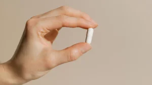 woman-hand-holding-vitamin-supplement-capsule.webp.webp